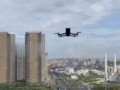 Жительница Астаны получила уведомление от дрона отойти от окна во время съемки подготовки к параду