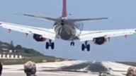 Who saw the lady in red instead of the plane